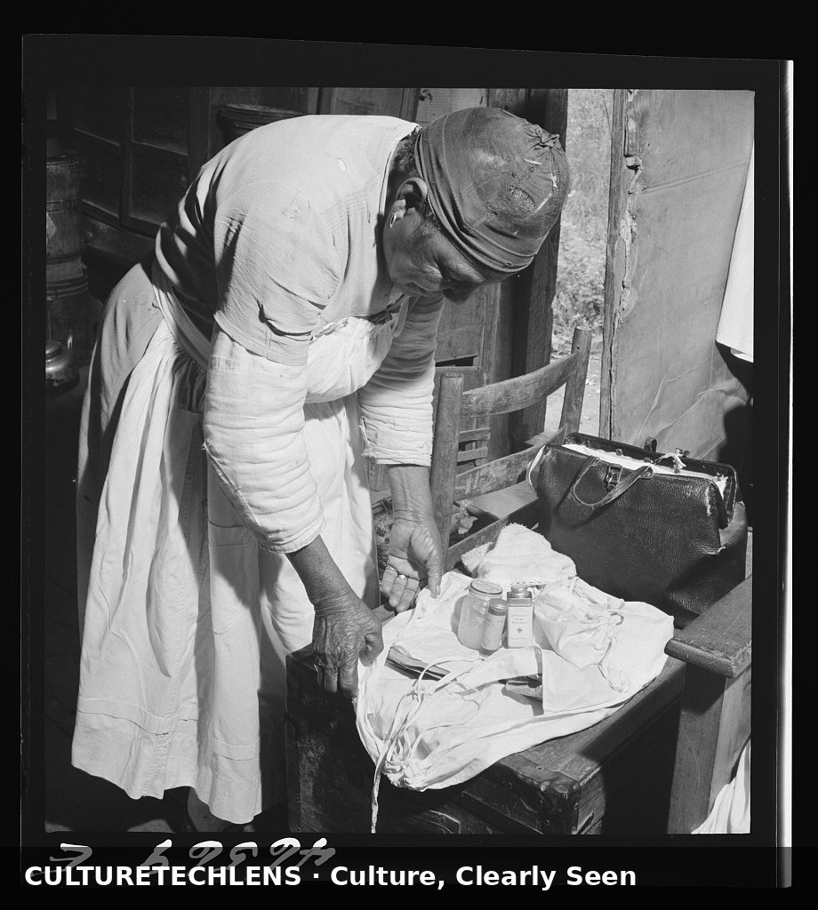A midwife wrapping her kit to go on a call, Greene County, Georgia, October 1941 (Jack Del