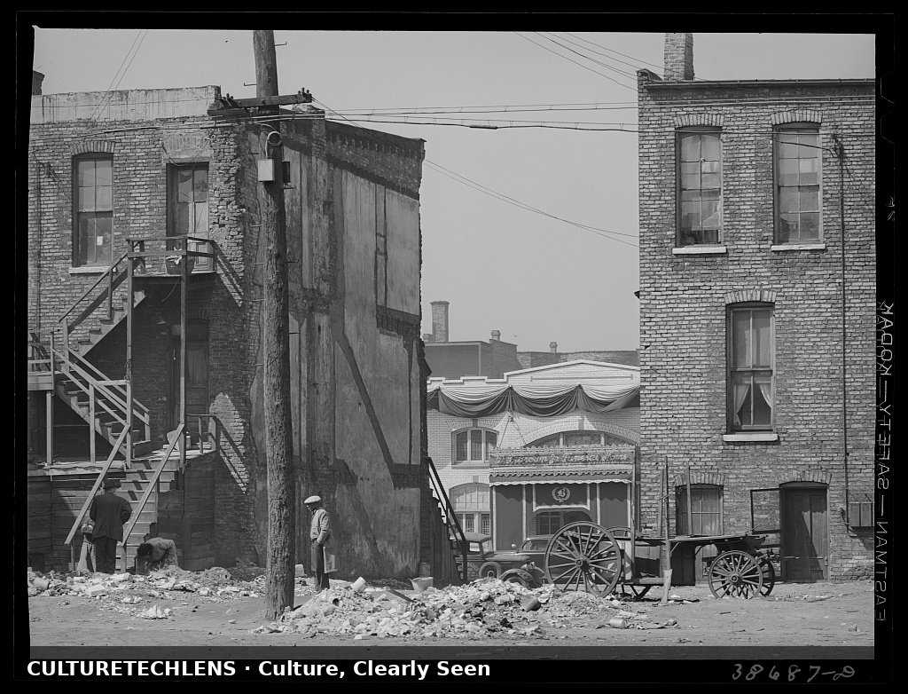 Apartment houses and funeral parlor in Negro section of Chicago, Illinois, 1941 — CultureT