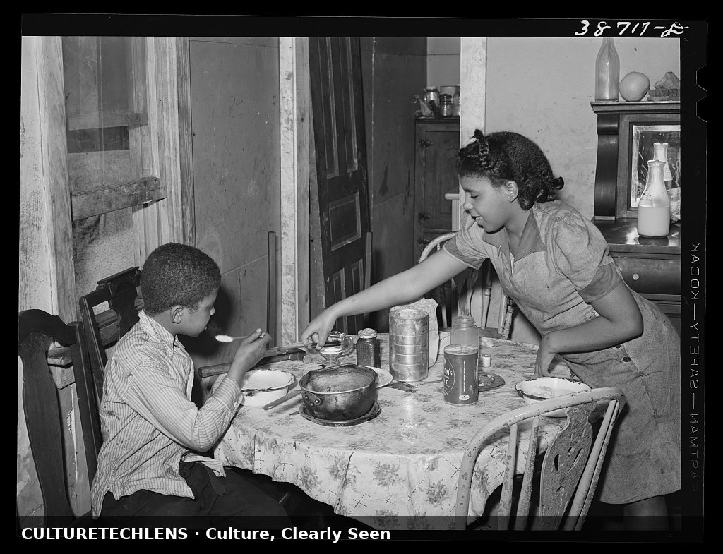 Children at the table in a kitchenette apartment, Chicago, 1941 — CultureTechLens
