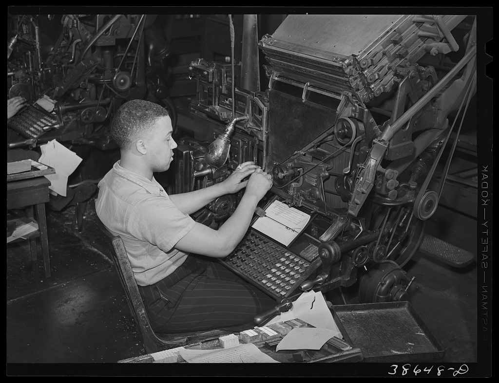 Linotype operator setting type at the Chicago Defender, Chicago, 1941