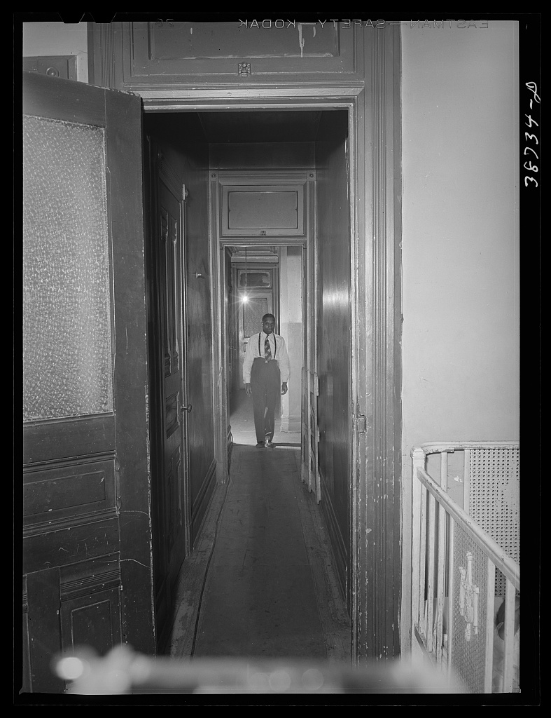 Hallway of a kitchenette apartment building, Chicago, 1941