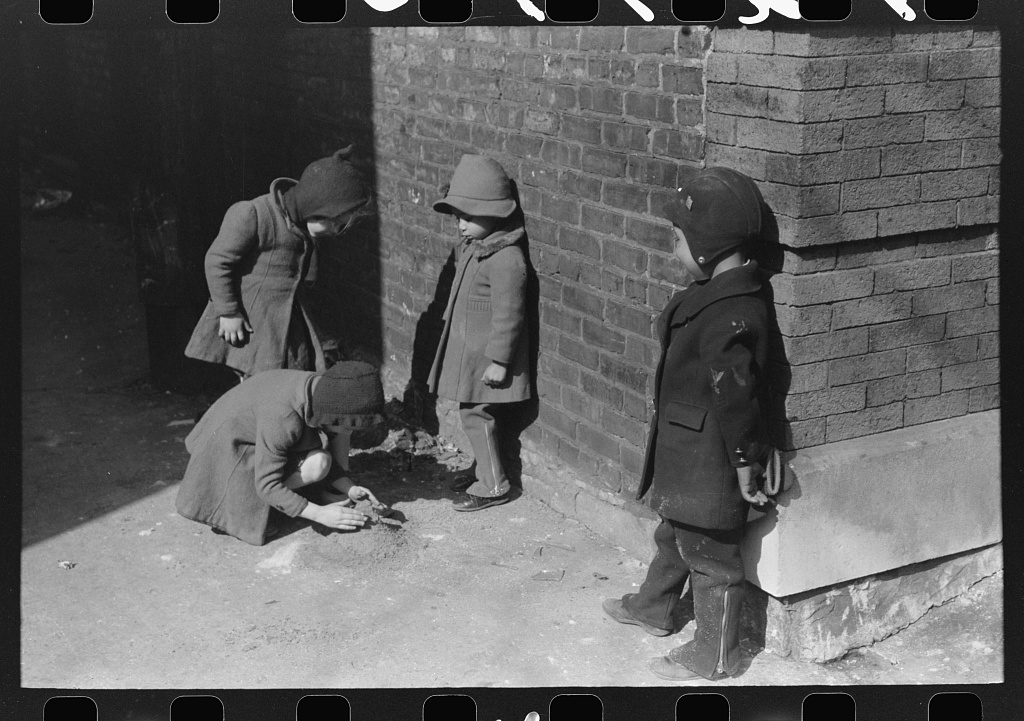 Where the Negro and white sections on the South Side meet, the white and Negro children sometimes play together, Chicago, Illinois, Chicago, 1941