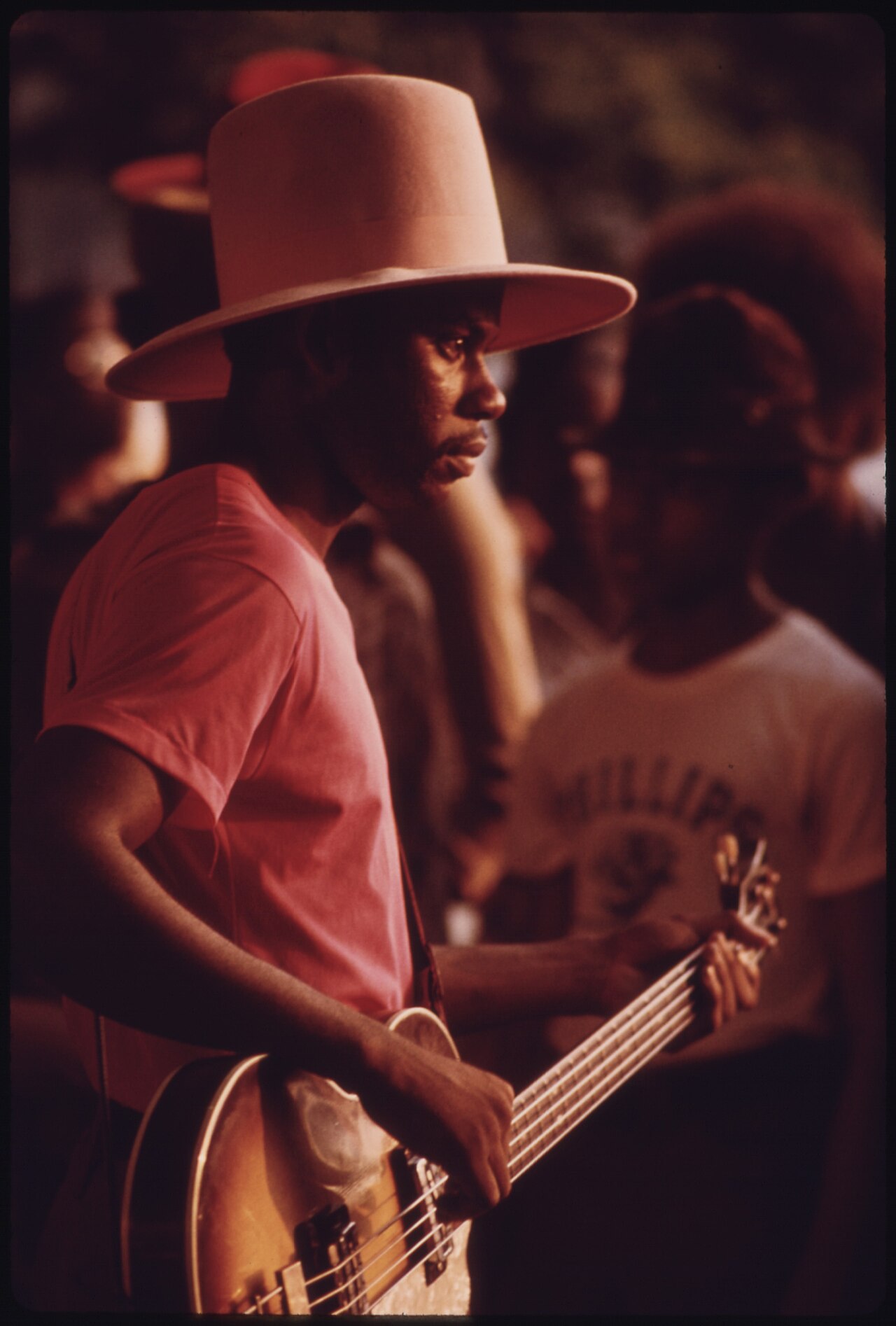 A black guitarist performs at the lake meado, Chicago